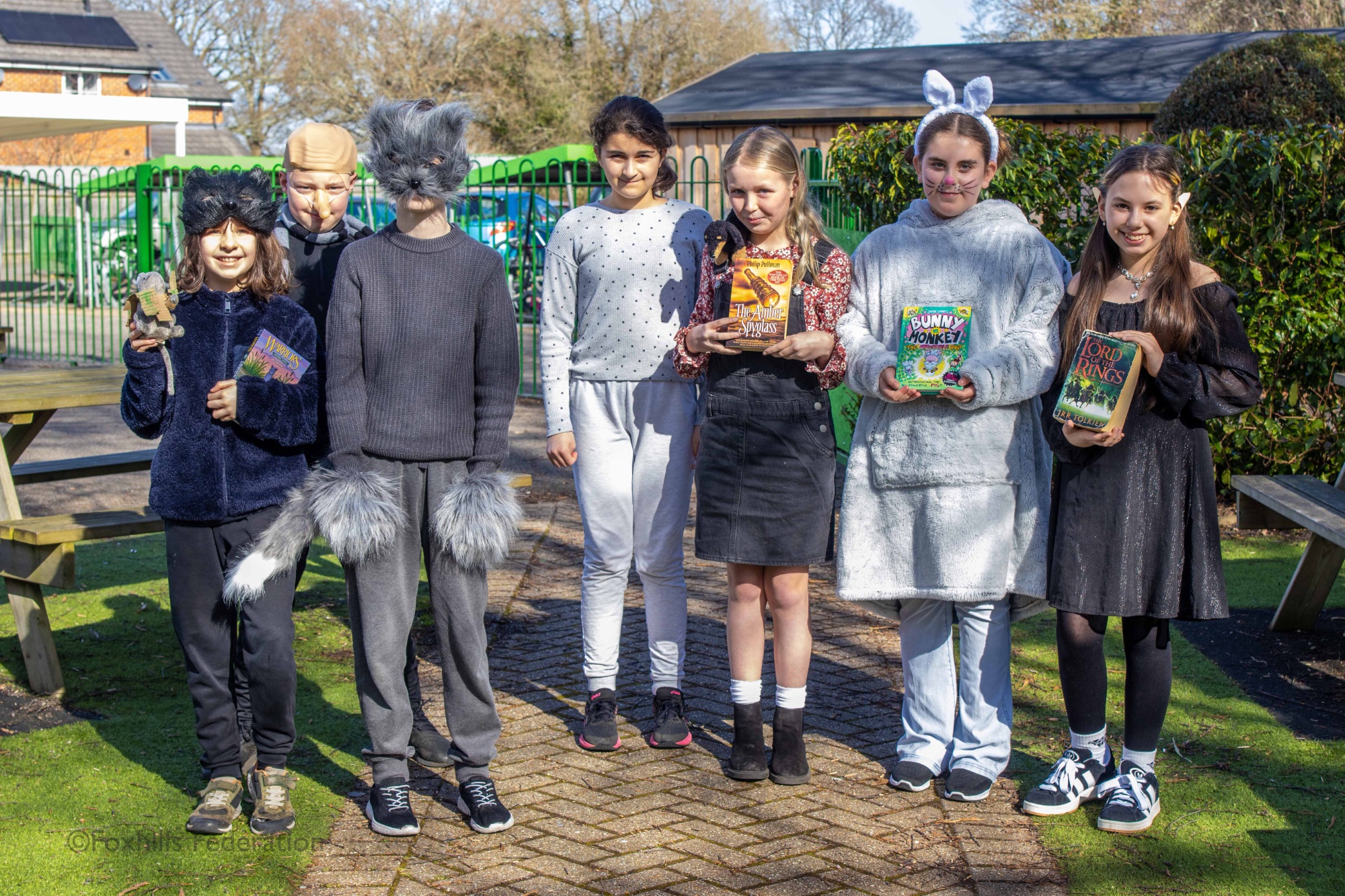 Children pose in outifts for World Book Day