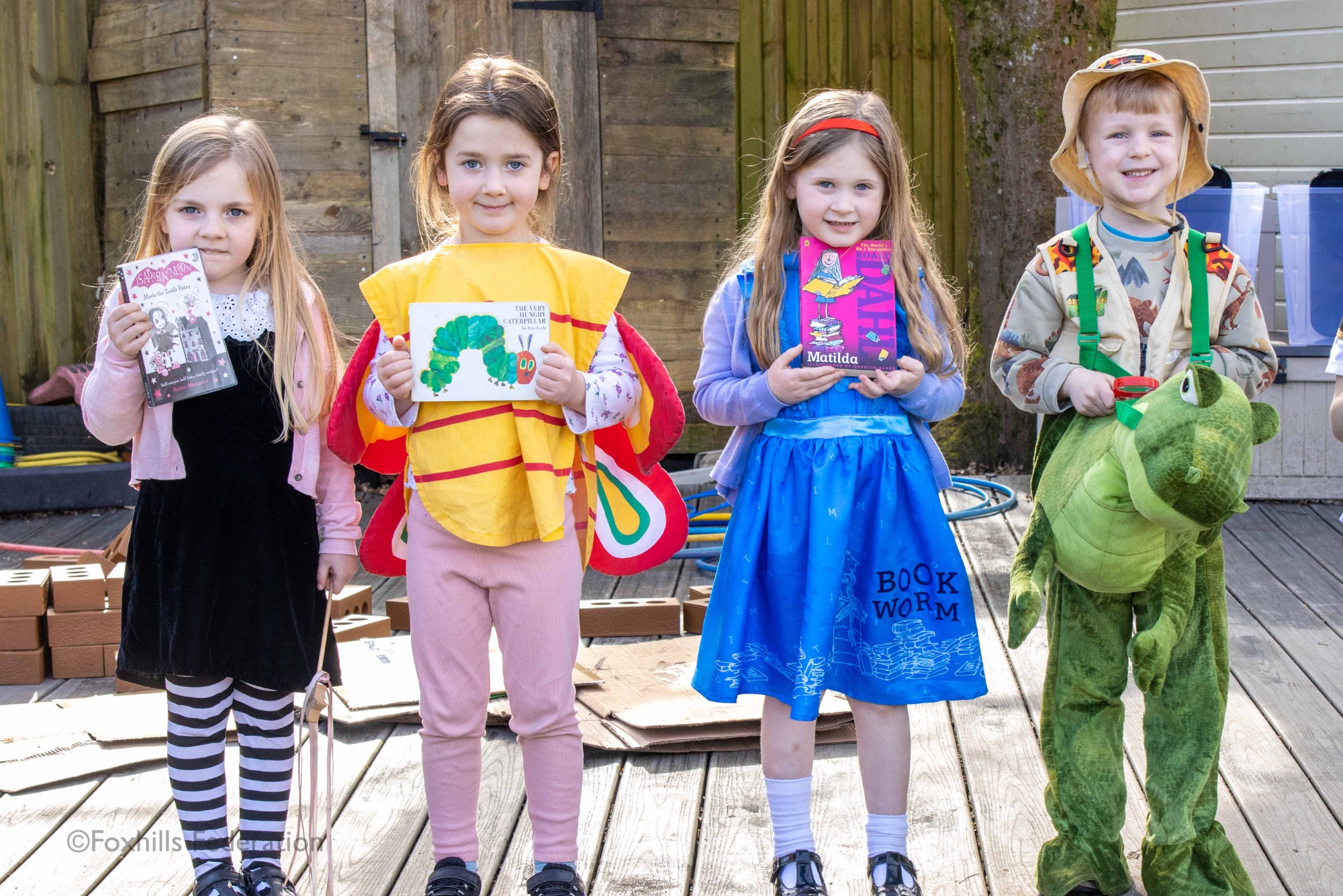 Children pose in outifts for World Book Day