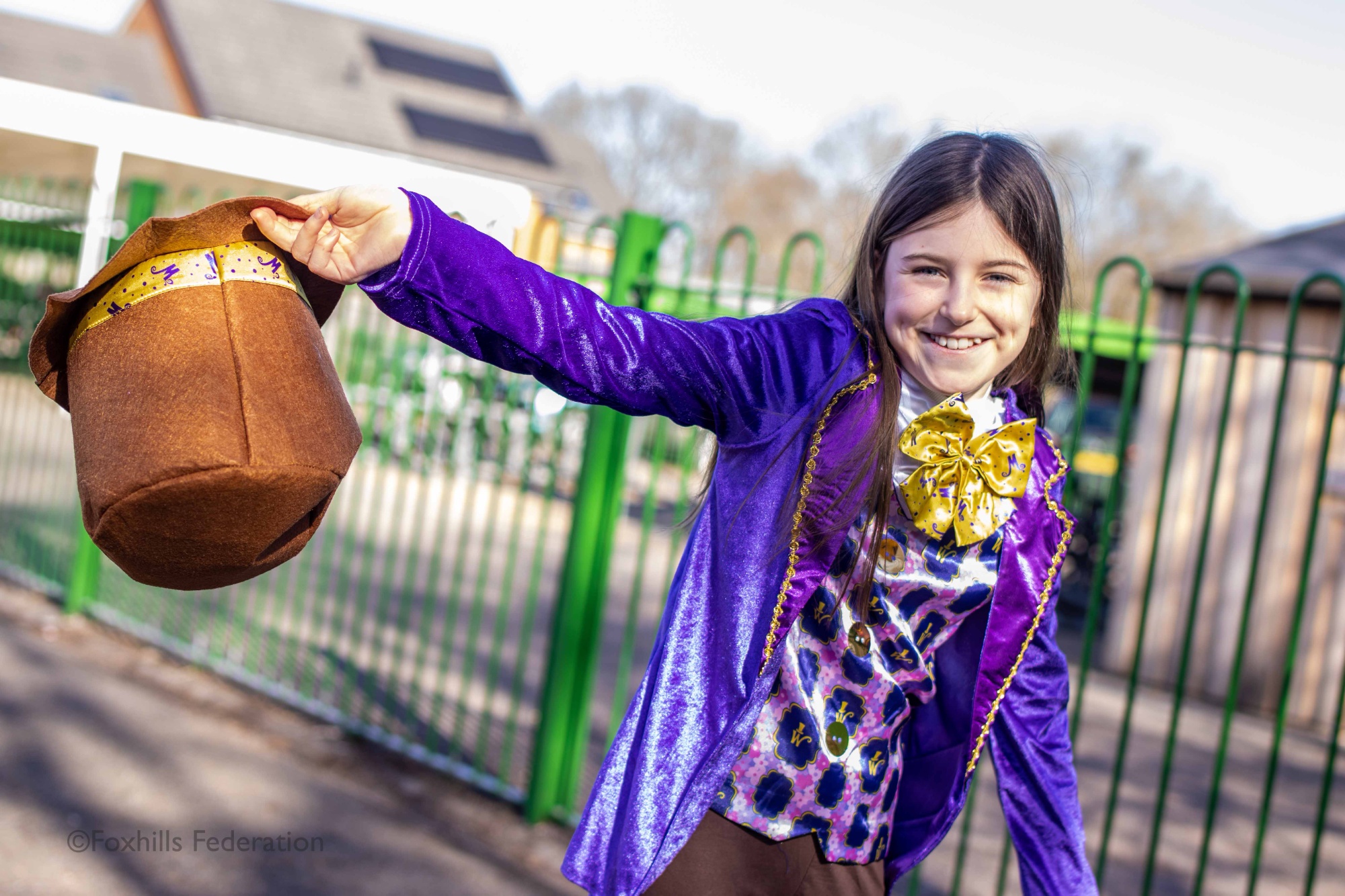 A girl is dressed as Willy Wonka