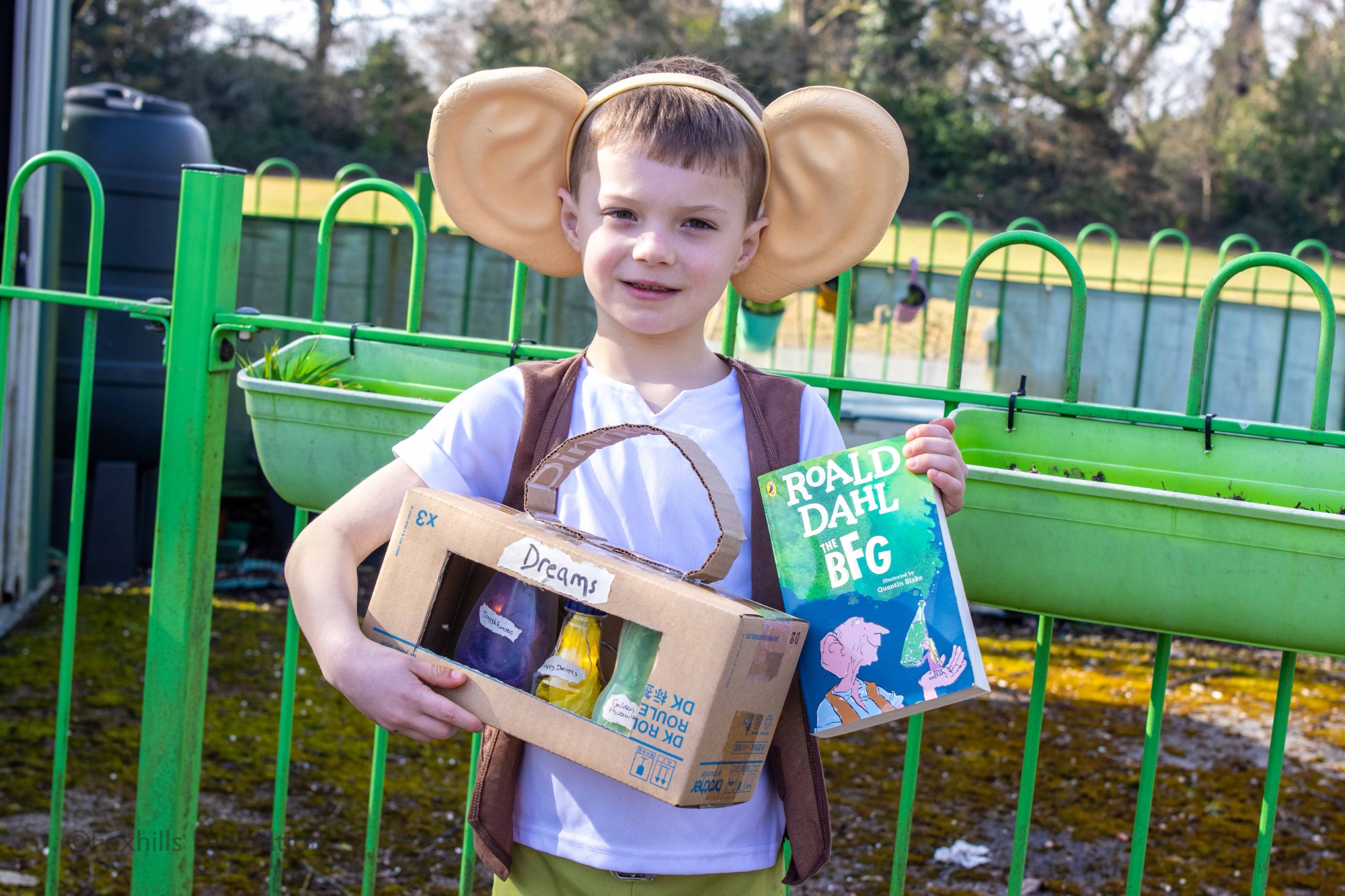 A boy is dressed as the BFG