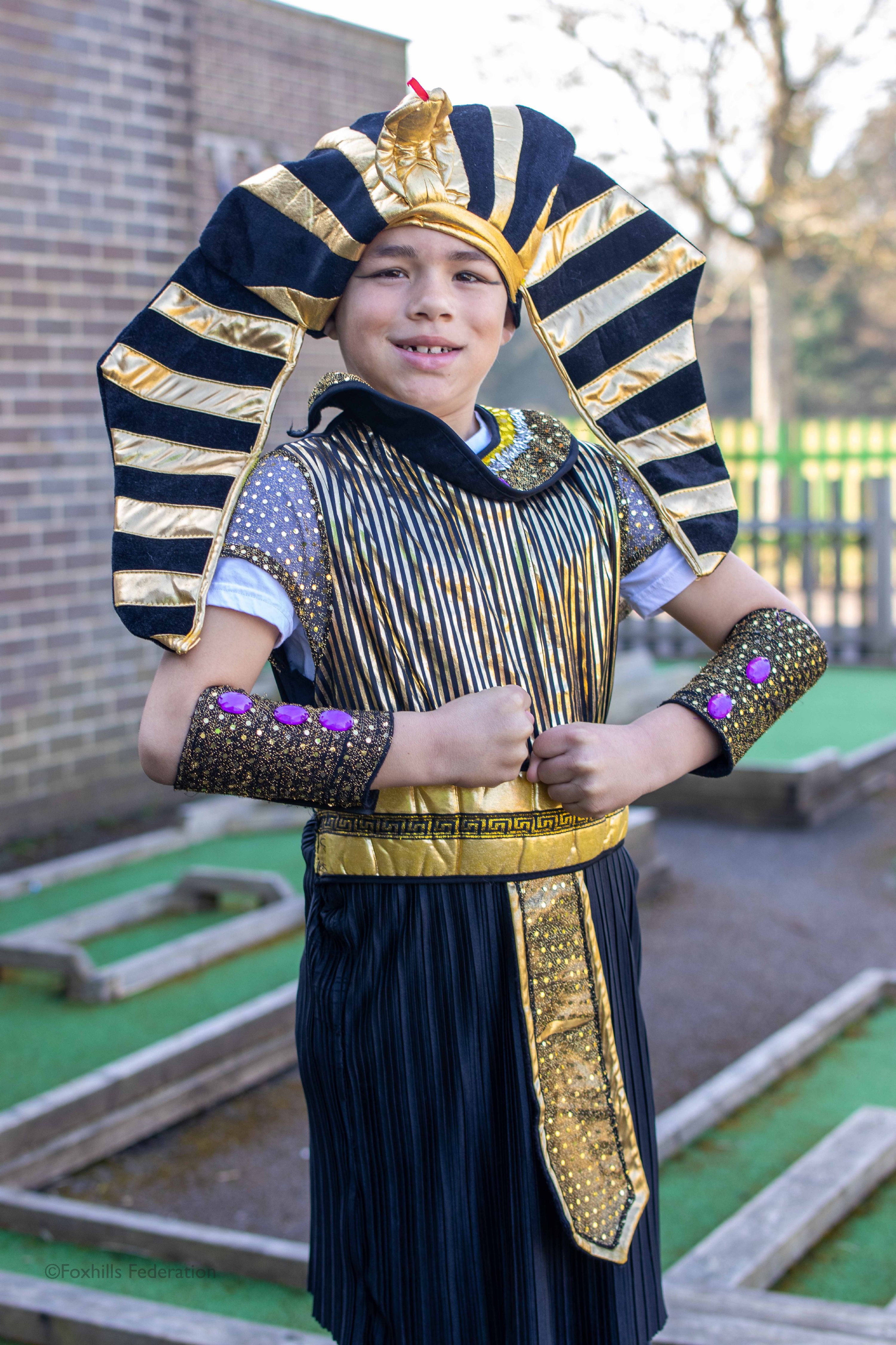 A child wears a Pharaoh outfit