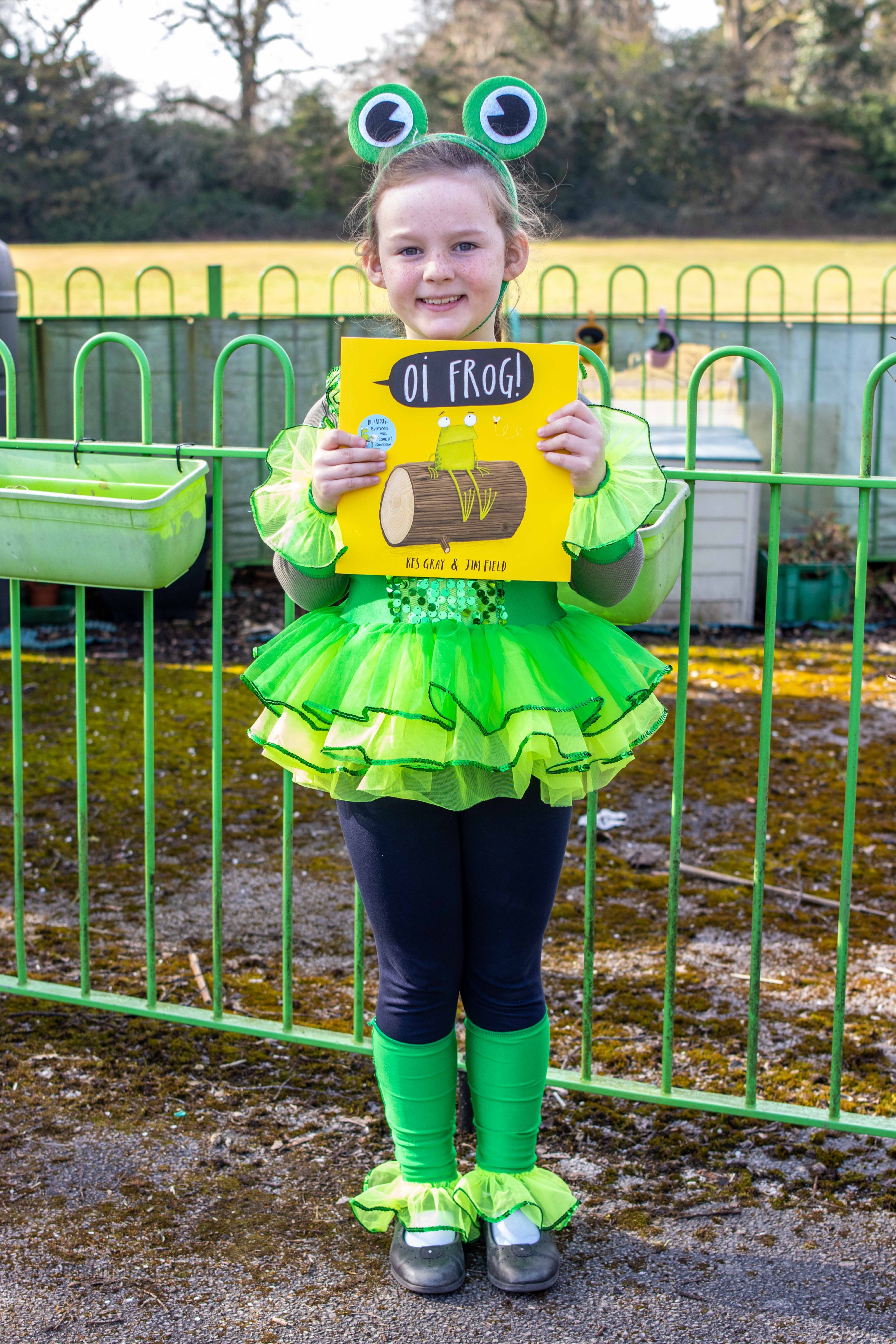 A girl dresses as a frog